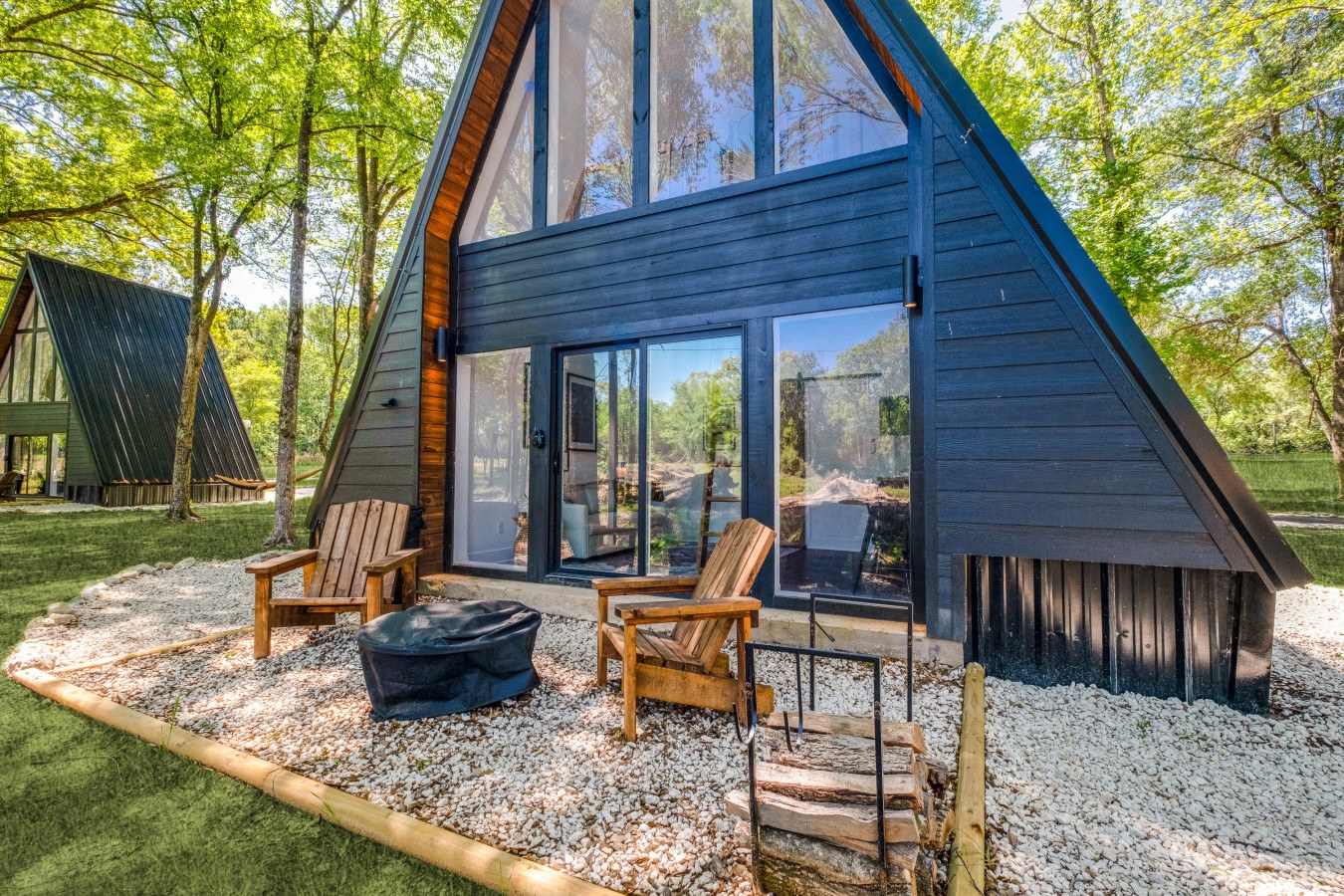 Outdoor seating beside an A-frame at Lake Noire